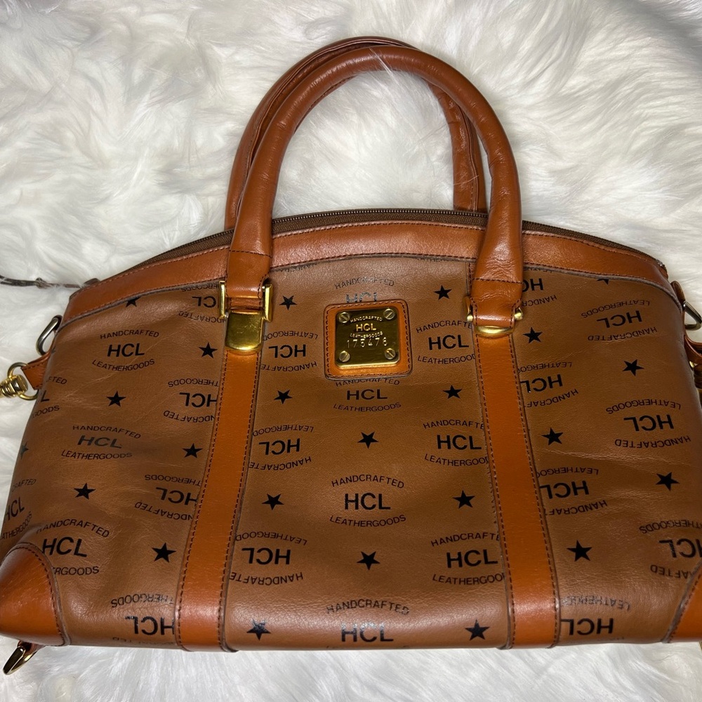 Brown Handcrafted Leather Bag with its dust bag.